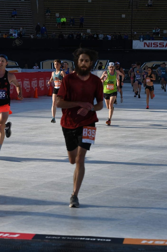 A photograph of me finishing the 2019 Bolder Boulder